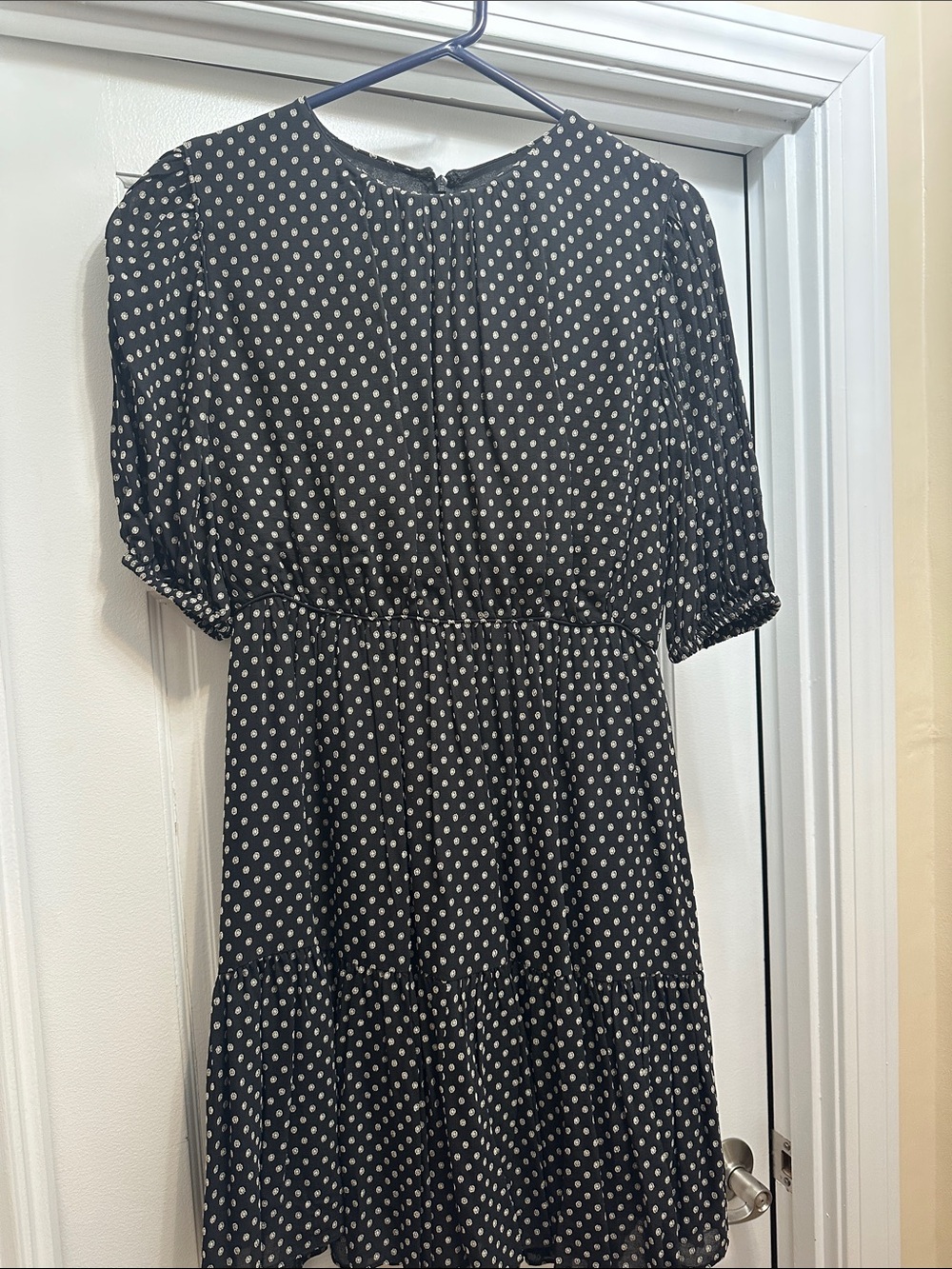 A mini cute black and beige dress.
